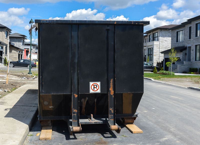 Rented Black Dumpster at a Construction site